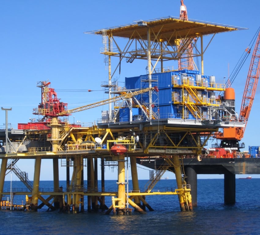 An offshore platform with several stacked technical buildings, used for portable accommodations and work space.